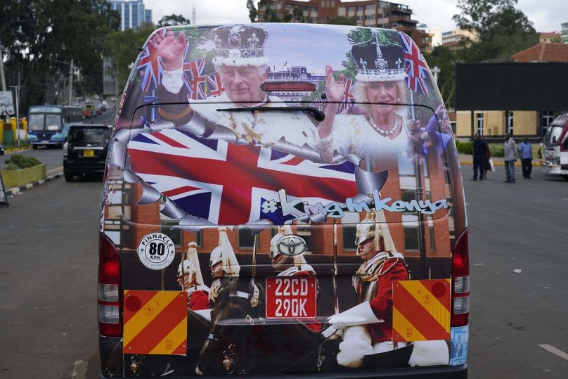 A view of a matatu in Nairobi adorned with photos of Britain's King Charles III and Queen Camilla ahead of their state visit to Kenya.
