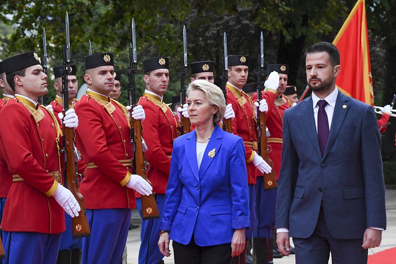European Commission President Ursula von der Leyen, center left, reviews the honour guard with Montenegro's President Jakov Milatovic in Montenegro's capital Podgorica.