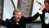 James Cameron yells "I'm king of the world" after accepting the best director Oscar for "Titanic" at the 70th Academy Awards in Los Angeles.