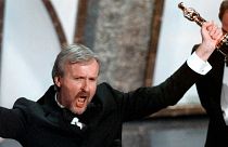 James Cameron yells "I'm king of the world" after accepting the best director Oscar for "Titanic" at the 70th Academy Awards in Los Angeles.