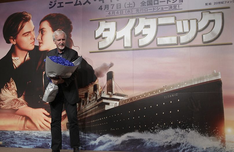 Director James Cameron poses for photographers during a press conference to promote his 3-D version of "Titanic" in Tokyo Friday, March 30, 2012.