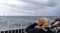 Guests tour the five turbines of America's first offshore wind farm, owned by the Danish company, Ørsted, off the coast of Block Island, R.I., on Oct. 17, 2022.