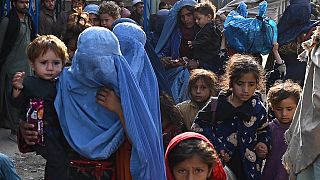 Afghan refugees arriving from Pakistan walk at the Afghanistan-Pakistan Torkham border in Nangarhar province on November 2, 2023.