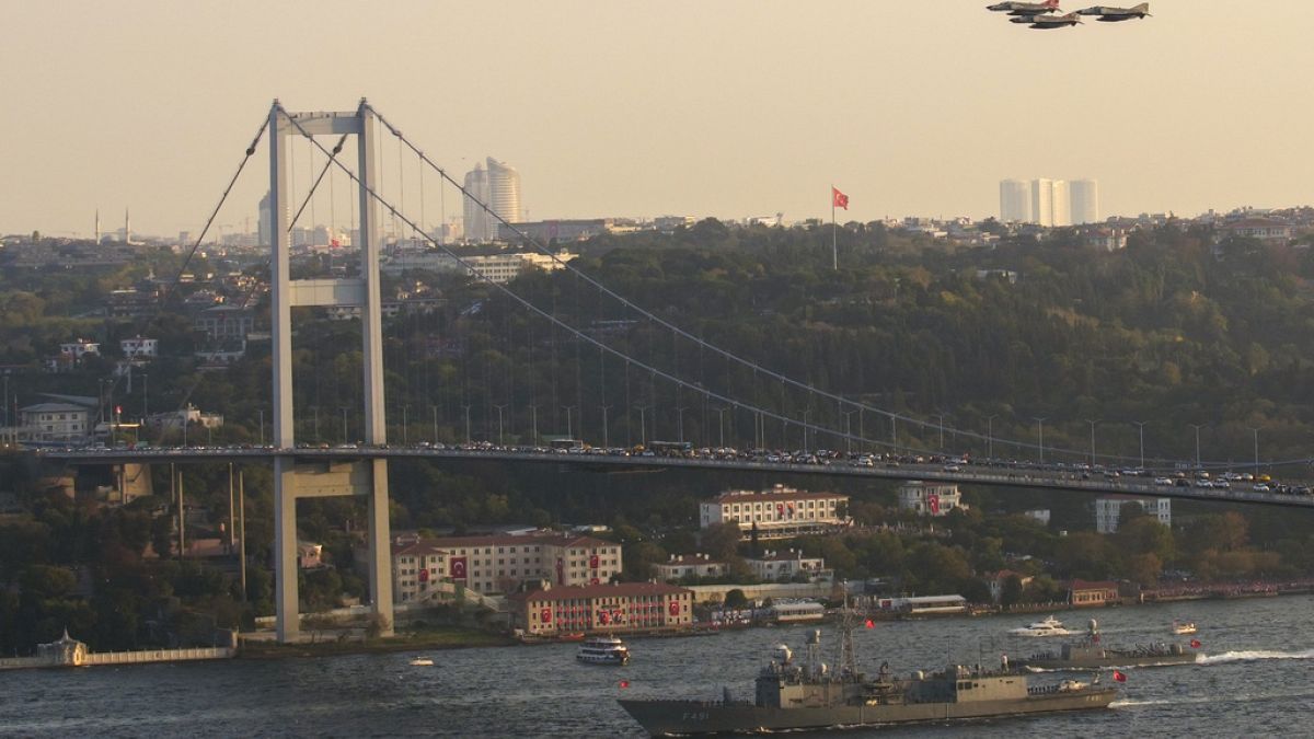 Ships of the Turkish Navy performs a military parade under 15 July martyrs bridge on Bosphorus marking 100th anniversary of Turkish republic in Istanbul, on 29 Oct 2023