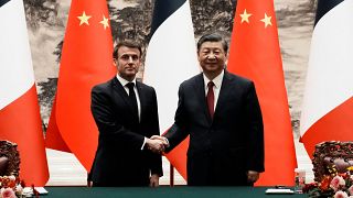 French President Emmanuel Macron meets Chinese Premier Xi Jinping.