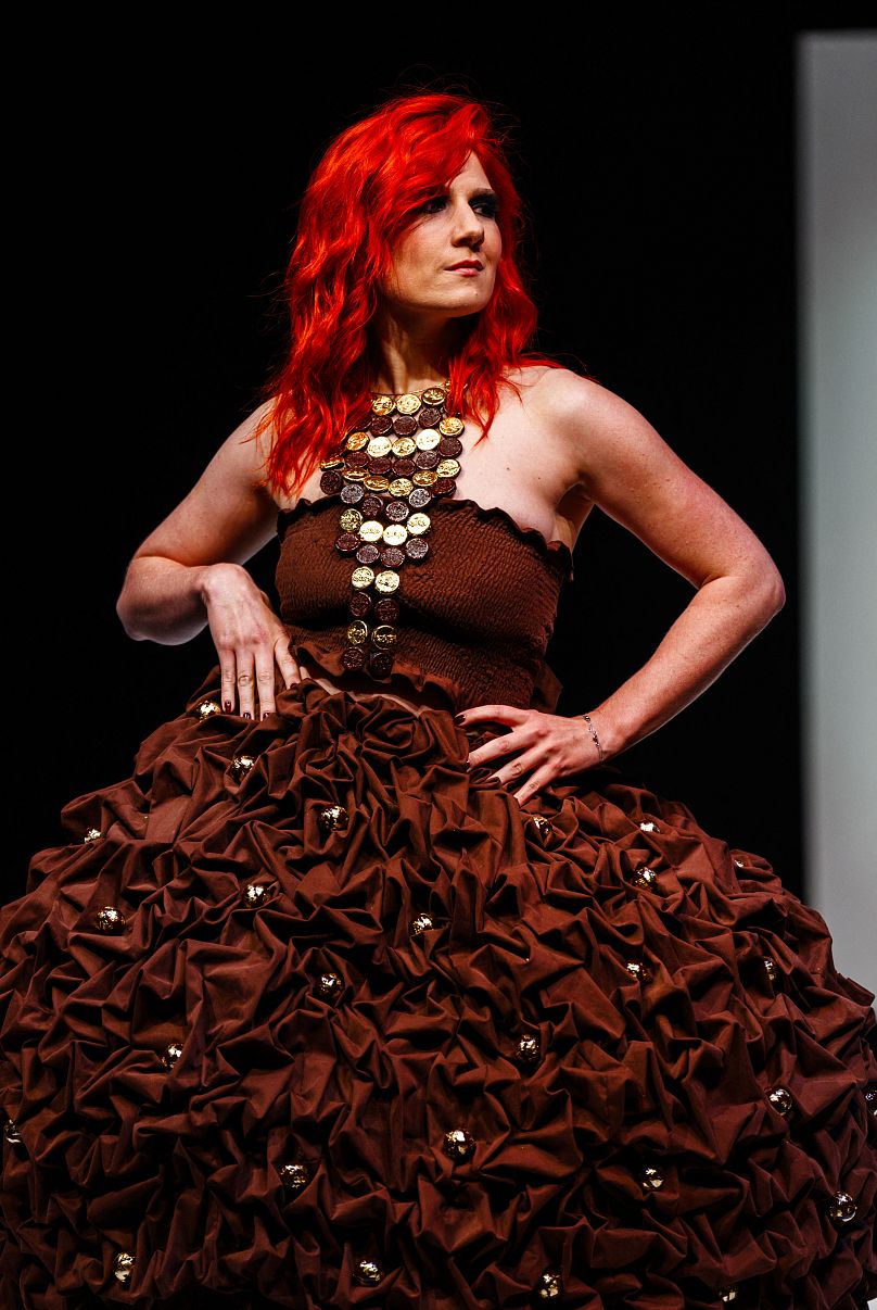 French vocalist Adeline Toniutti walks the runway during the parade of chocolate dresses during the Salon du Chocolat de Paris 2023 in Paris on October 27, 2023.