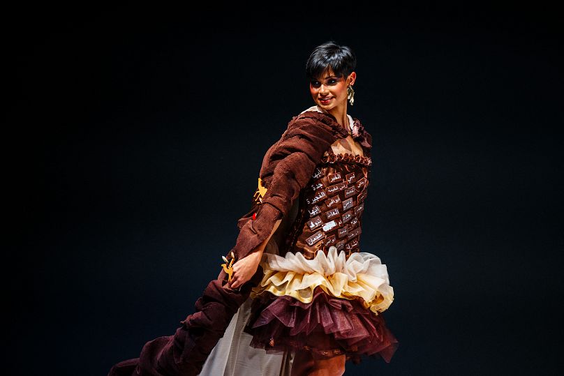 French model Eve Gilles walks the runway during the parade of chocolate dresses during the Salon du Chocolat de Paris 2023 in Paris on October 27, 2023.