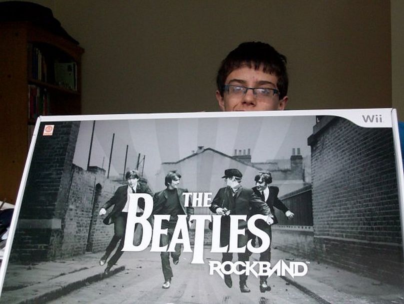 Myself at 14 in 2009 posing with my 'soon-to-be' Christmas present. The Beatles Rockband exposed the band to a new generation of kids and teenagers