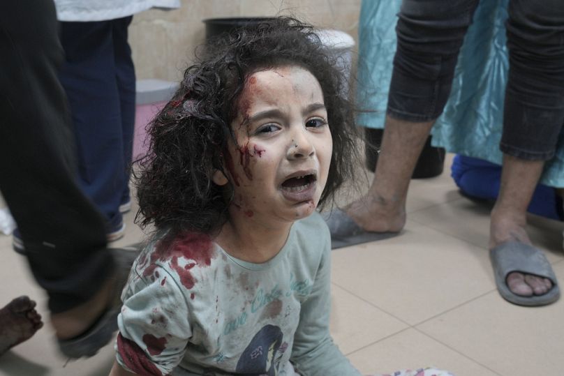 Palestinian child wounded in Israeli bombardment is brought to a hospital in Deir al Balah, south of the Gaza Strip, Thursday, Nov. 2, 2023.
