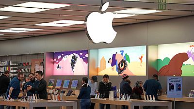 Customers shop in an Apple store in Pittsburgh. Jan. 30, 2023.