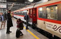 People say goodbye before boarding the first European Sleeper train to Berlin, at the Midi Station in Brussels, Belgium, 26 May 2023. 