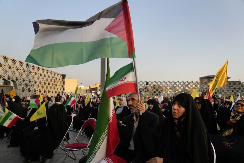 Iranians watch a speech of Hezbollah leader Sayyed Hassan Nasrallah on a screen in Tehran, Iran, Friday, Nov. 3, 2023.