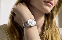 Model wears Breitling Navitimer Automatic 36