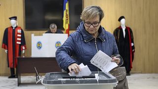 A woman casts her vote during local elections in Chisinau, Moldova on Sunday