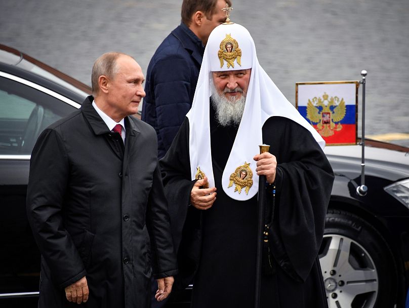 In 2017, Russian President Vladimir Putin and Russian Orthodox Church Patriarch Kirill attend a ceremony on Moscow's Red Square during National Unity Day.