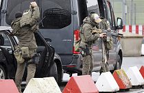 Heavily armed special police forces prepare for an operation at the airport, in Hamburg, Germany, Sunday, Nov. 5, 2023. 
