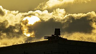 An air defense system is seen during sunset on the roof of the main building of the Russian Defense Ministry in Moscow, Russia, Wednesday, Nov. 1, 2023. 