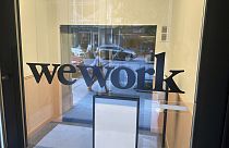 A sign for WeWork is displayed at their office in the borough of Manhattan in New York, Aug. 9, 2023.