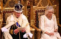 Britain's King Charles III delivers his speech as Queen Camilla sits next to him during the State Opening of Parliament at the Houses of Parliament, in London, Tuesday, Nov. 7