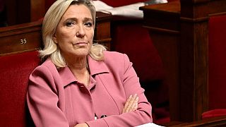 Marine Le Pen listens during a session on the situation in the Middle East at the French National Assembly in Paris on 23 October