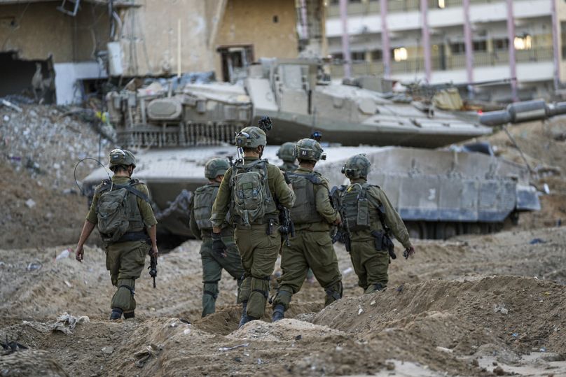 Israeli soldiers are seen during a ground operation in the Gaza Strip, Wednesday, Nov. 8, 2023.