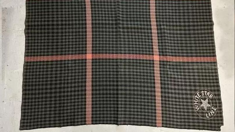 A tartan blanket used by one of the survivors
