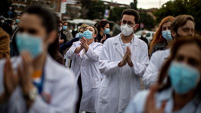 Healthcare workers protest against plans by Madrid's authorities to force staff to transfer to other hospitals at La Paz hospital in Madrid, Spain.