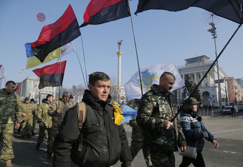 Ukrainian army veterans march to pay tribute to the victims of the 2013-2014 anti-government protests during commemoration events in central Kyiv, Ukraine, 20 Feb, 2017.