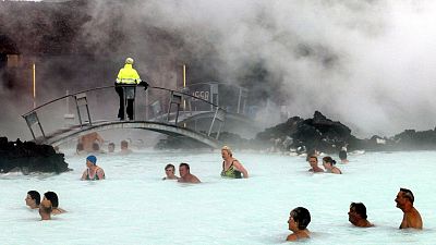 FILE: Bathers enjoy the warm water of the Blue Lagoon on Iceland on 5 September 2003. 