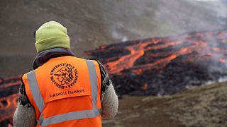 FILE: Scientists and students of the department of Geology of the University of Iceland, observe the eruption and take measurements of the Fagradalsfjall volcano, July 2023
