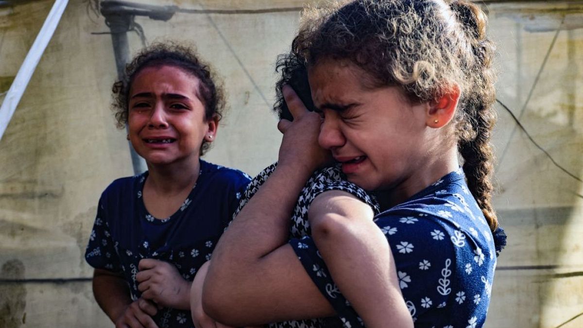  Children react during the funeral of the Faojo family, killed in Israeli bombing on Rafah in the southern Gaza Strip