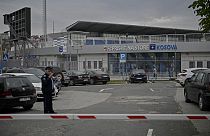 Kosovo police officer stands guard near the Fadil Vokrri stadium, in Pristina on November 10, 2023