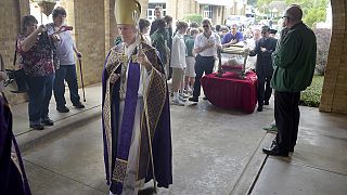 Bishop Joseph Strickland walks in front of a reliquary bearing the bones of Saint Maria Goretti, on Monday, Nov. 2, 2015, in Tyler, Texas. 