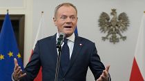 Polish opposition leader Donald Tusk speaks during the signing ceremony of a coalition agreement that he sealed with the leaders of other parties, in Warsaw, Poland