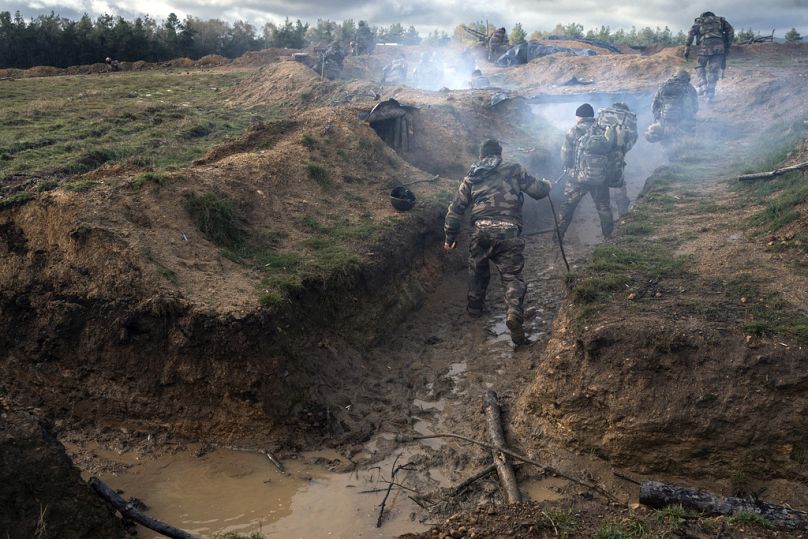 Ukrainian infantrymen train with French soldiers to learn combat skills, in France, Tuesday, Nov. 7, 2023.