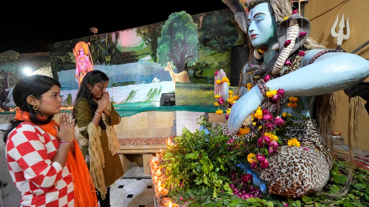 Hindu women pray to celebrate Diwali, the festival of lights, at Somi Narin temple in Karachi, Pakistan, Sunday, Nov. 12, 2023.