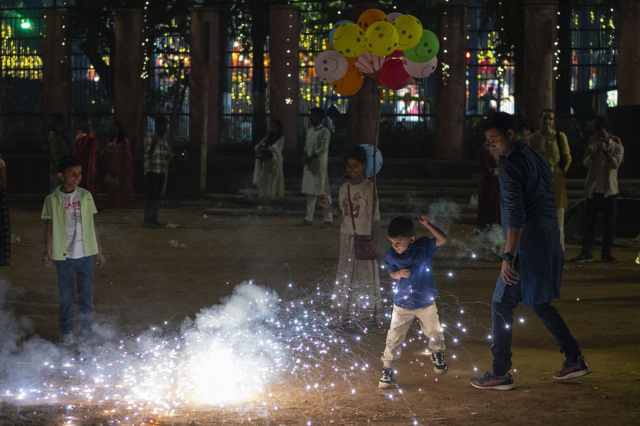 People light fire crackers during festival of lights Diwali in Mumbai, India, Sunday, Nov. 12, 2023.