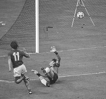 France's Bruno Bellone (11) scores a second goal against Spain's Luis Arconada during the France-Spain final of the European Championship in France, June 27, 1984.