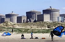 Kite surfers in front of the Gravelines nuclear plant near Dunkirk, northern France. April 18, 2015.