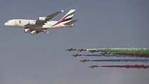 An Emirates Airline A-380 leads the "Al Fursan", or the Knights, a UAE Air Force aerobatic display team, during the opening day of the Dubai Air Show on Nov. 12, 2017.