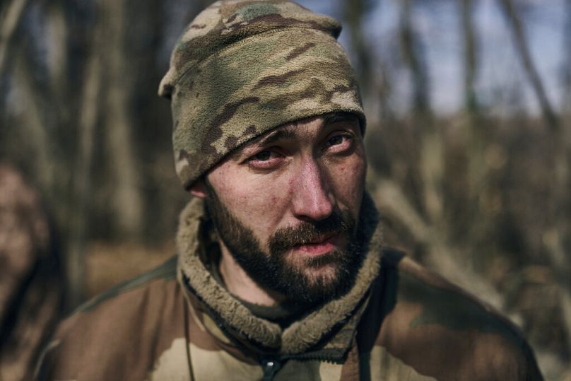 FILE - A Ukrainian soldier looks on at the frontline close to Bakhmut, Donetsk region, Ukraine, Sunday, March 5, 2023.