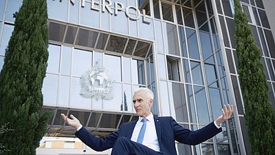 Interpol Secretary General Jurgen Stock talks to journalists during an interview outside the Interpol headquarters in Lyon, central France, Tuesday, Sept. 5, 2023. 