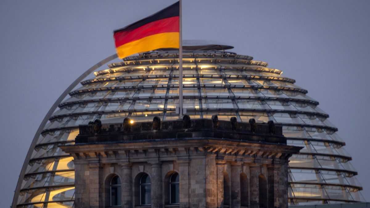 The German national flag waves on top of the Reichtstag building in Berlin, Germany, Thursday, Aug. 31, 2023. The Reichstag is the home of the German parliament Bundestag. 
