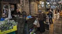 A woman shops at the Mahane Yehuda market in Jerusalem, Monday, November 13, 2023.