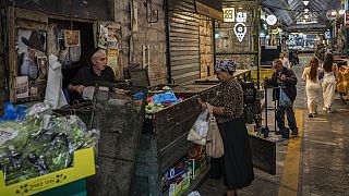 A woman shops at the Mahane Yehuda market in Jerusalem, Monday, November 13, 2023.