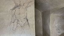 Delicate charcoal drawings that some experts have attributed to Michelangelo are seen on the walls of a room in central Italy, Tuesday, Oct. 31, 2023. 