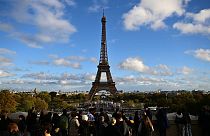 Tourists near the Eiffel Tower, Paris, November 2023.