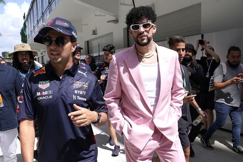 Red Bull's Sergio Perez walks with Bad Bunny before the Formula One Miami Grand Prix on May 8, 2022, in Miami Gardens.