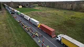 Trucks near the Polish-Ukrainian border crossing in Dorohusk, Poland on November 10, 2023 as Ukrainian drivers protest and ask Polish police officers to let them pass.
