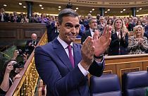 Spain's acting Prime Minister Pedro Sanchez applauds at the start of the investiture debate at the Spanish Parliament in Madrid, Spain, Wednesday, Nov. 15, 2023.